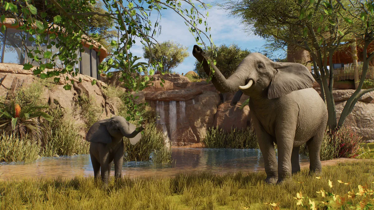 African elephants gathered at a watering hole in a savanna habitat